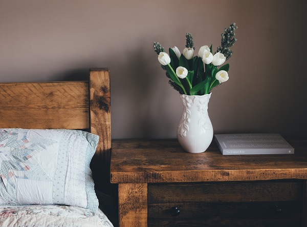 Home bedroom with bed and nightstand