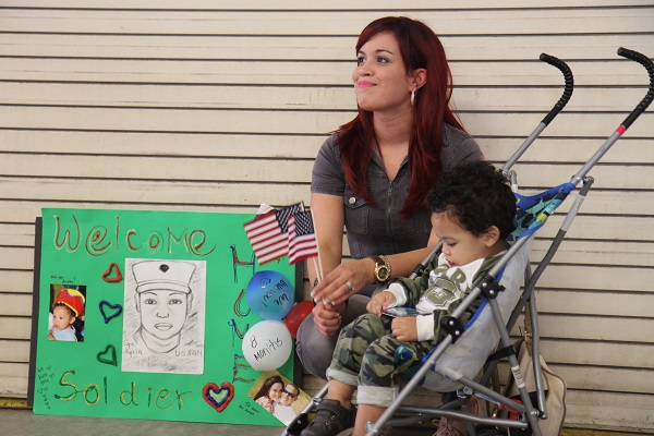 mother and son wait for military family member