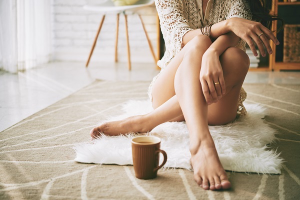 Woman sitting on floor with healthy skin