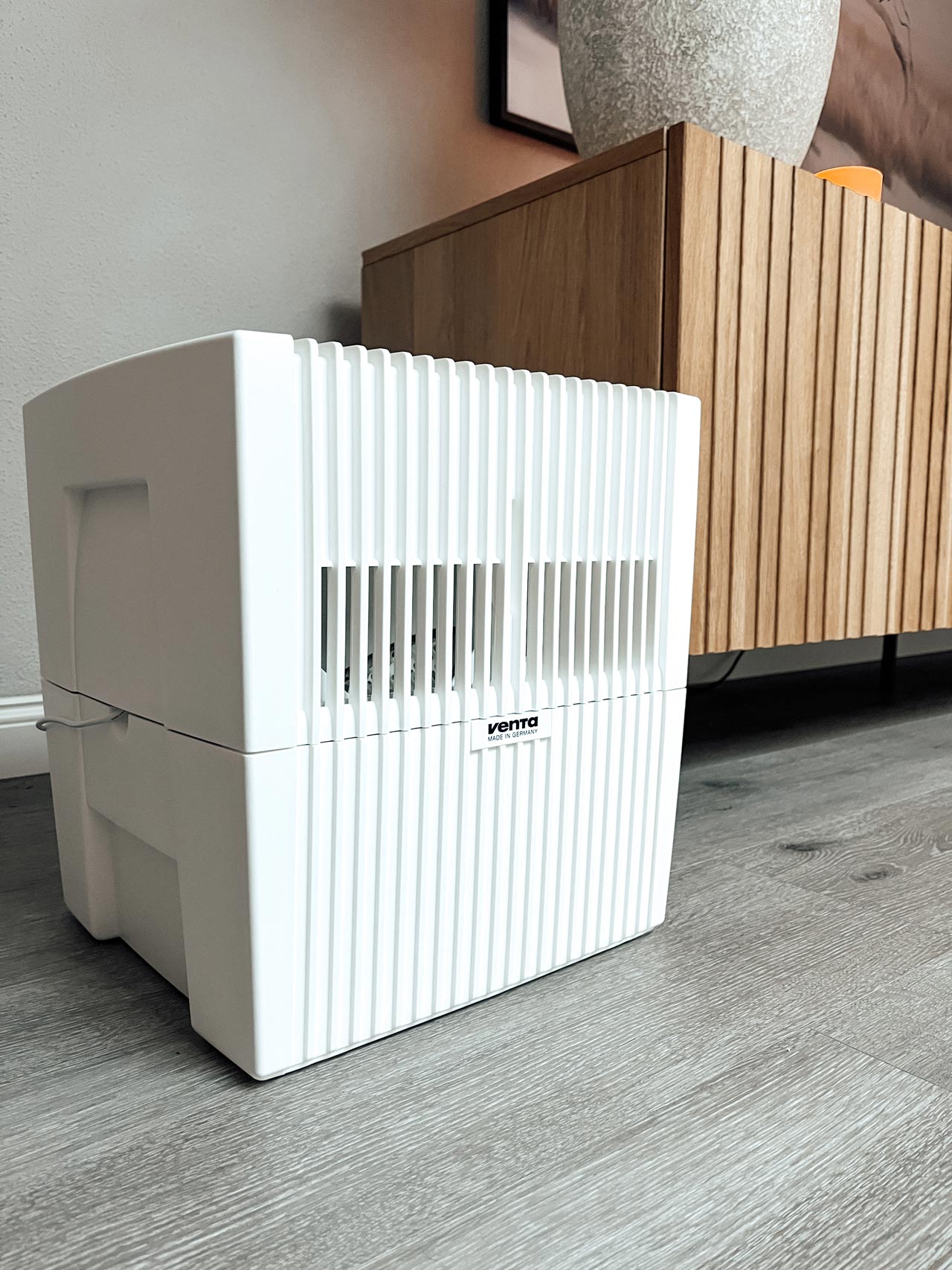 Venta humidifier original next to a shelf in the home office.