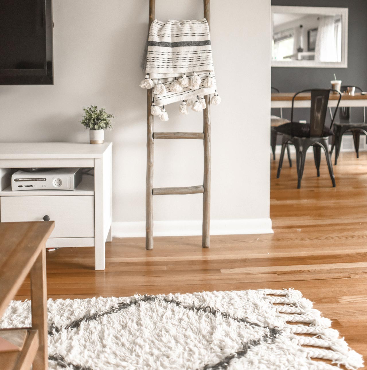 View into a living room with passage to the dining room.