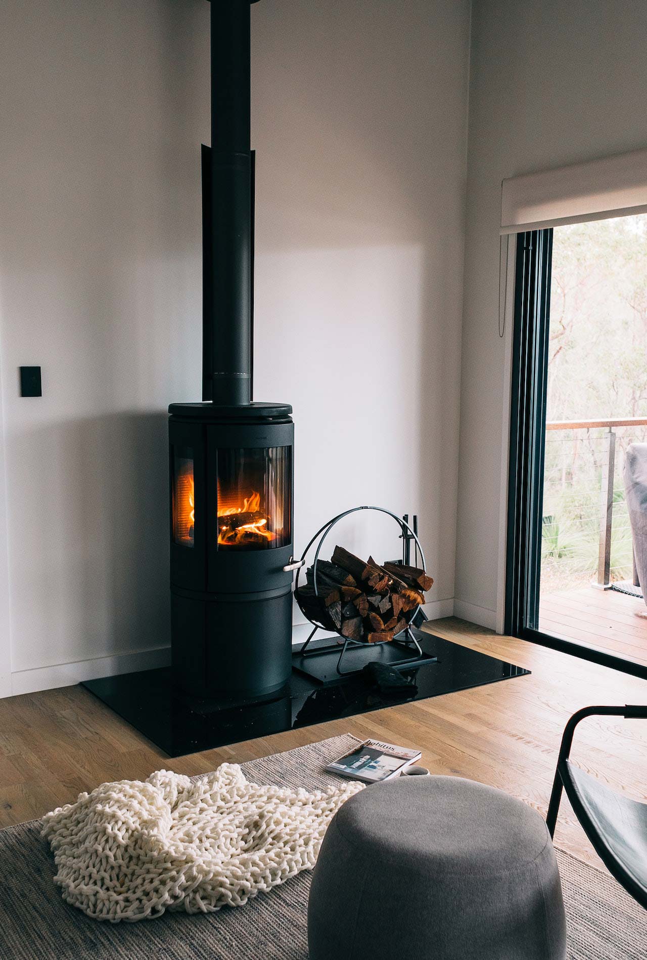 Round tiled stove in the living room.