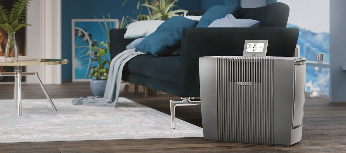 Venta humidifier Professional in a large blue living room.