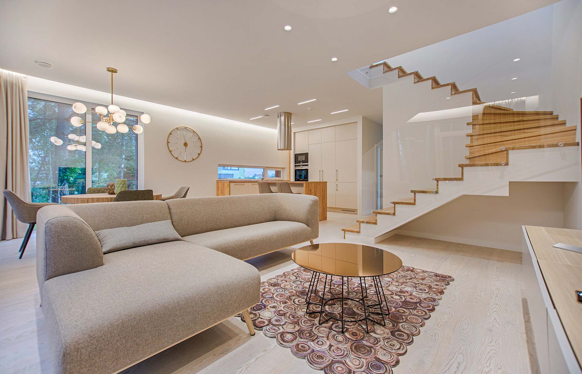 View into a large living room with staircase.